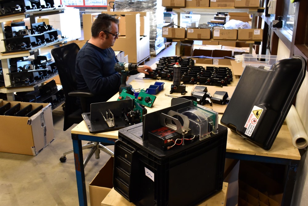 Employee refurbishes smart rat traps from Strygo at custom working company Lidwina, illustrating a successful circular collaboration between the two companies.