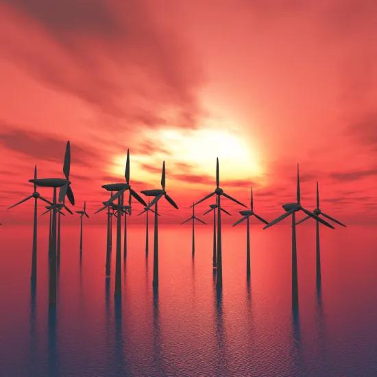 Offshore windmolens tegen zonsondergang