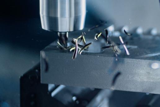 close-up of a metal component being machined