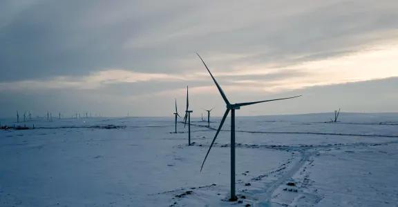 Wind turbines in cold snowy landscape