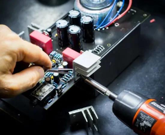 male hand working on hardware board