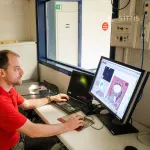 man sitting in front of laptop 3d design