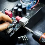 male hand working on hardware board