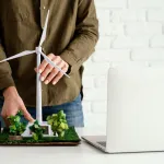 Woman working on scale turbine model