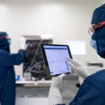 ABN smart product two men working on a pre-engineered and modular cleanroom